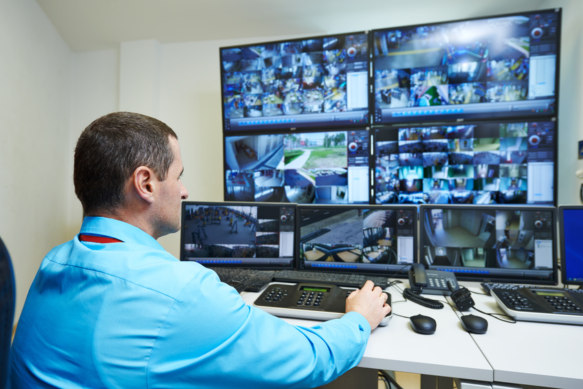 security guard watching video monitoring surveillance security